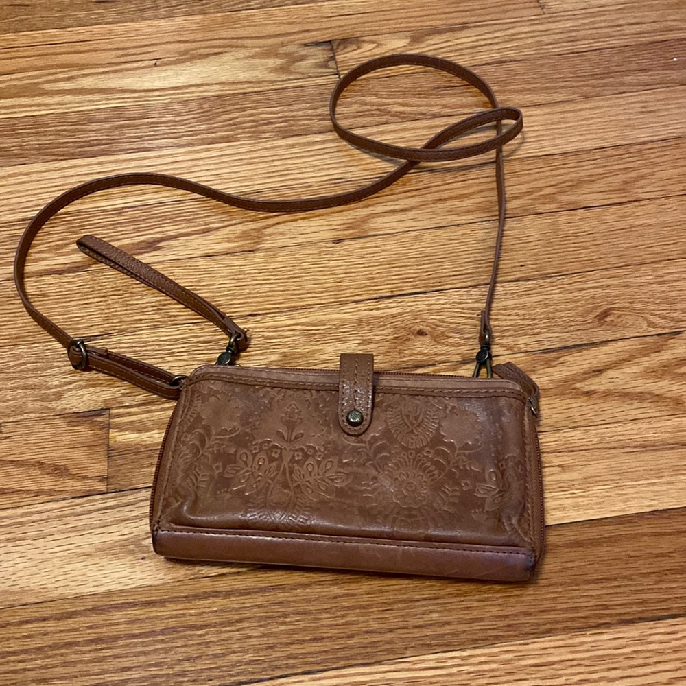 The Sak tan leather zip around wallet convertible crossbody wristlet clutch